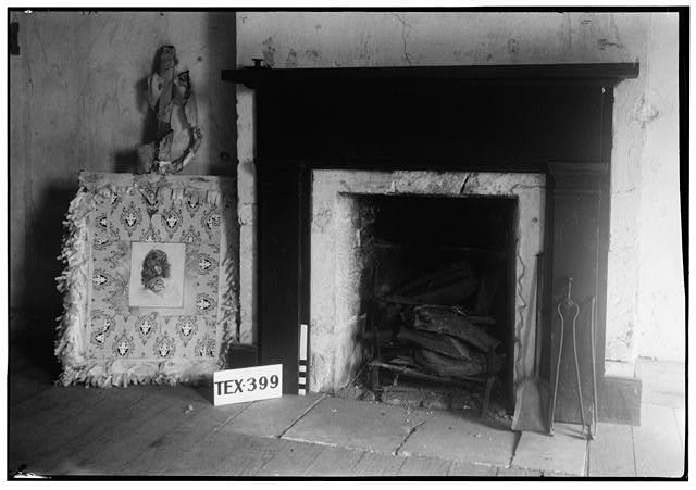 Black and white photograph of the second floor fireplace of the Sneed House, 1936