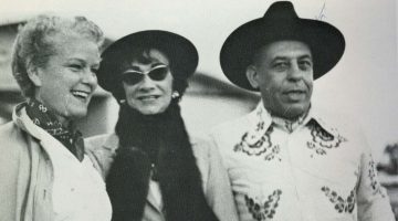 Black and white photograph of Coco Chanel attending a Western Party with Stanley Marcus and his wife in Dallas, Texas in 1957
