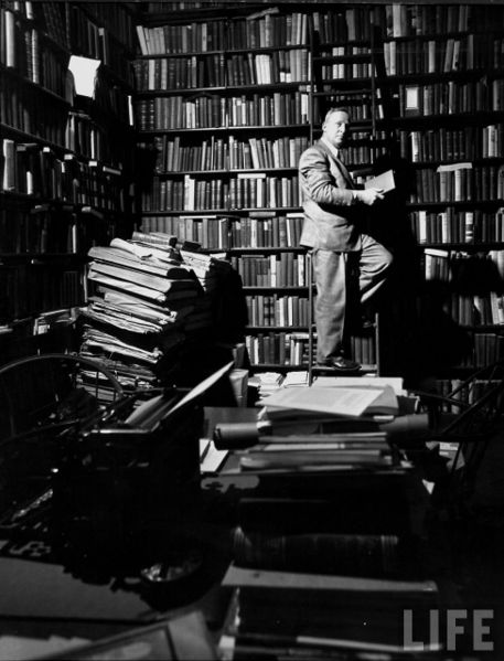 Black and white photograph of Allan Nevins in his library