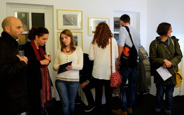Members of the Student Engagement Team discuss the exhibition with visitors. 