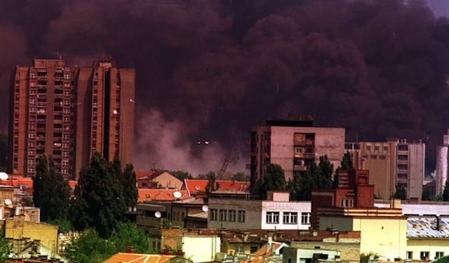 Smoke in Novi Sad, Serbia after NATO bombardment in 1999, via Wikipedia.