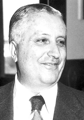 Black and white headshot of Ilya Prigogine