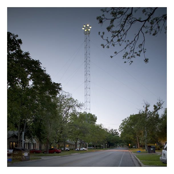 Image of modern moonlight tower in a residential neighborhood in Austin, Texas.
