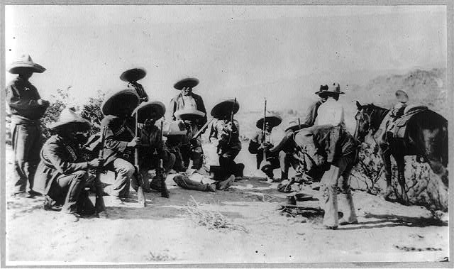 Black and white photograph of Mexican rebels camped outside Juárex, Mexico, 1911