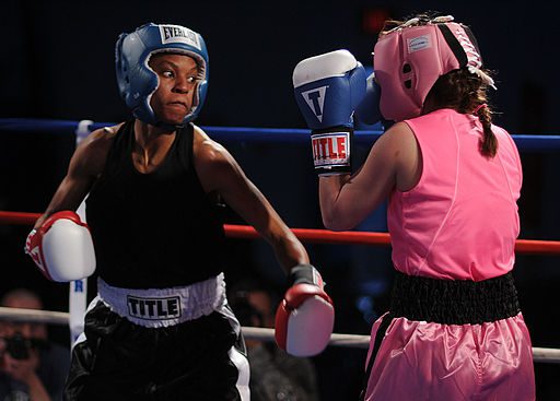 Master-at-Arms Seaman Rhonda McGee, left, spars with Patricia Cuevas during an exhibition match in the preliminary rounds of the 2011 Armed Forces Boxing Championship