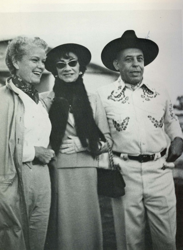 Black and white photograph of Coco Chanel attending a Western Party with Stanley Marcus and his wife in Dallas, Texas in 1957 