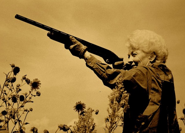 Image of Ann Richards firing a gun from the film, "Backwards and In High Heels" (Texas Democrats)