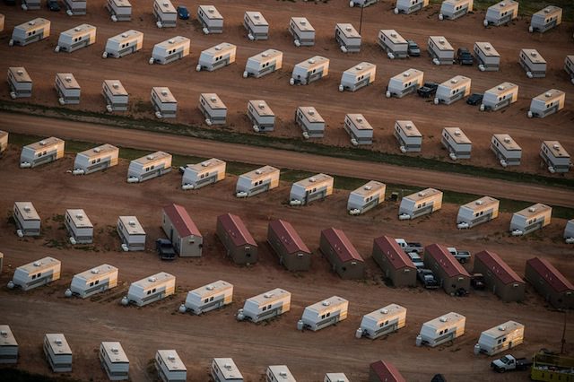 A trailer park occupied mostly by oil workers is seen in an aerial view in the early morning hours of July 30, 2013 near Watford City, North Dakota. Photo by Andrew Burton/Getty Images