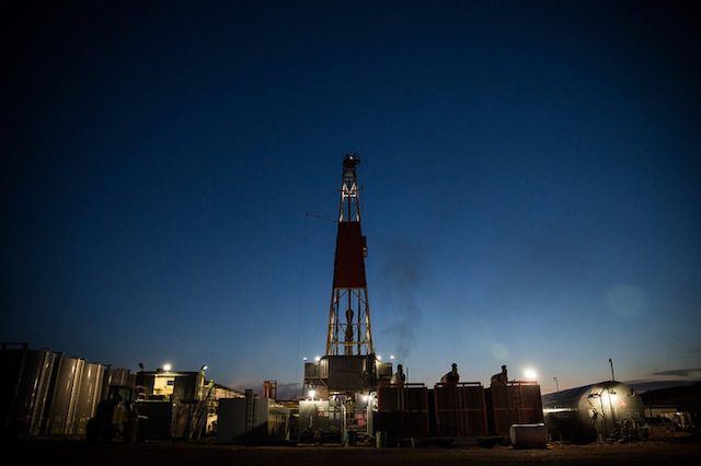 An oil derrick operated by Raven Drilling drills for oil in the Bakken shale formation on July 23, 2013 outside Watford City, North Dakota. (Photo by Andrew Burton/Getty Images)