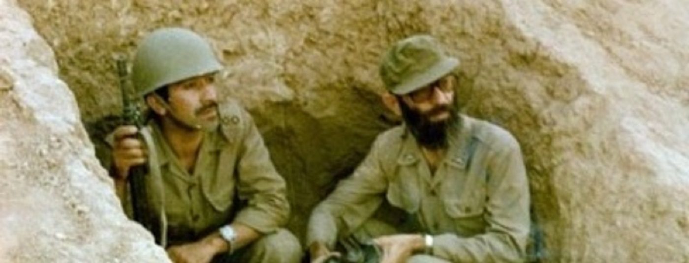 Ali Khamenei (right), the future Supreme Leader of Iran, in a trench during the Iran-Iraq war. Via Wikipedia