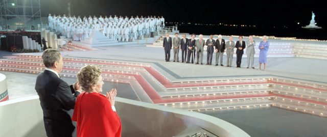 7/3/1986 President and Nancy Reagan at the Opening Ceremonies of Liberty Weekend with medals of liberty recipients Henry Kissinger, Franklin Chang-Diaz, I.M. Pei, Itzhak Perlman, James Reston, Kenneth Clark, Albert Sabin, An Wang, Elie Wiesel, Bob Hope, Hanna Holburn, Lee Iacoccaat Governors Island, New York