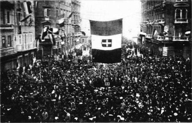 Residents of Fiume cheer the arrival of Gabriele d'Annunzio and his blackshirt-wearing nationalist raiders. D'Annunzio and Fascist Alceste De Ambris developed the quasi-fascist Italian Regency of Carnaro, a city-state in Fiume, from 1919 to 1920. D'Annunzio's actions in Fiume inspired the Italian Fascist movement. Via Wikipedia.