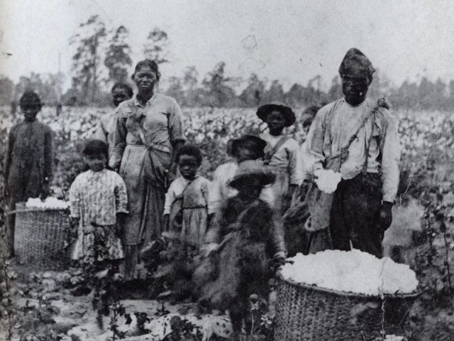Black and white image of a family of slaves in Georgia, circa 1850