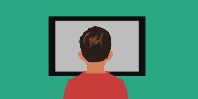 View of the back of a cartoon male child's head as they are staring at a black tv screen