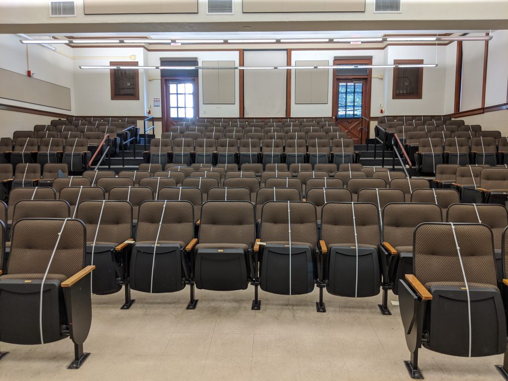 Photograph of an empty auditorium in Garrison Hall on UT Austin's campus