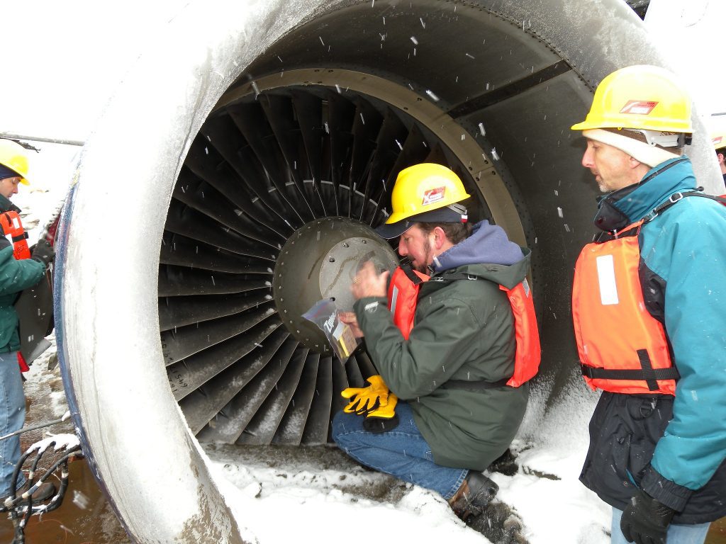 Following a wildlife strike (collision), USDA WS personnel or their partners collect evidence and “snarge” from the damaged plane. Snarge is the residue smeared on a plane after a wildlife strike.