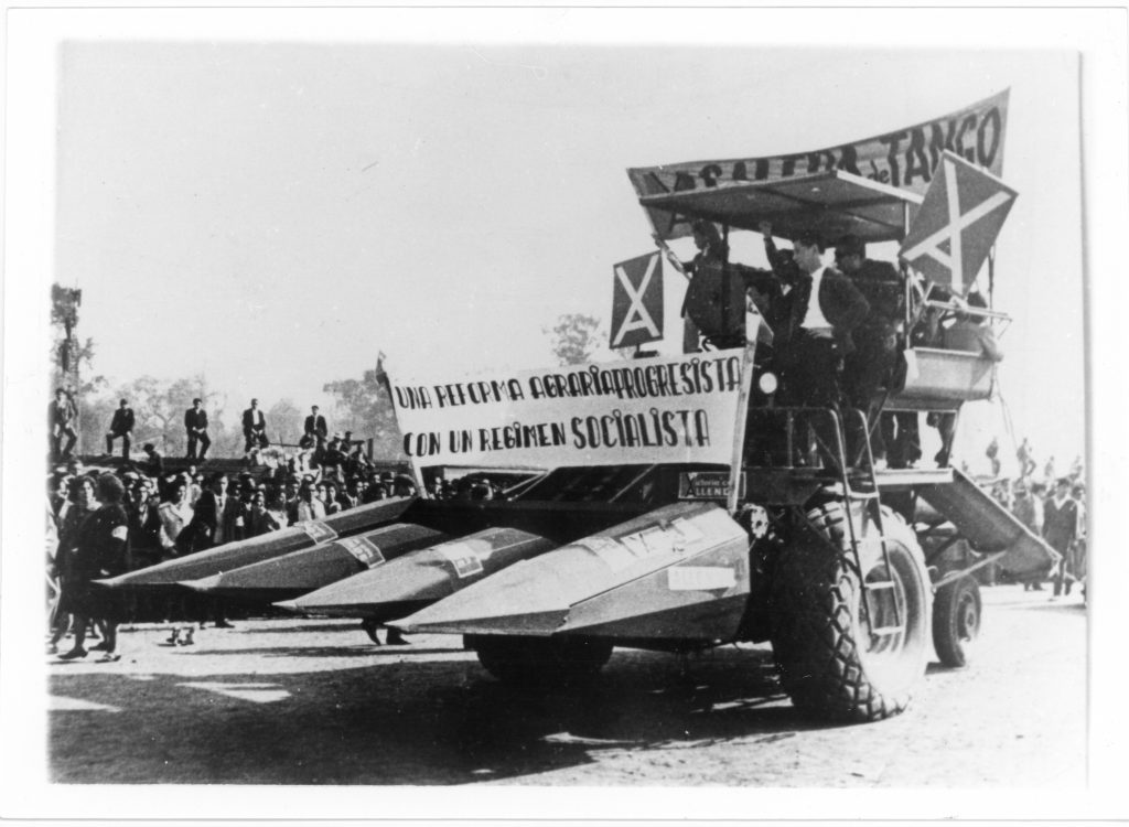 UP officials deliver a modern combine harvester to a rural community as part of the country’s agrarian reform