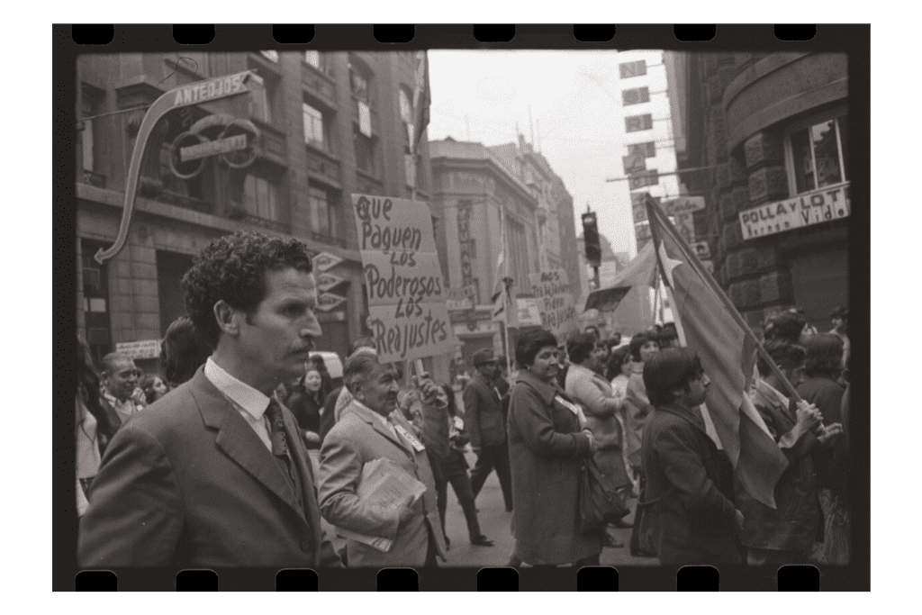 Allende supporters walk toward the government palace to hear his speech on International Workers Day, 1973