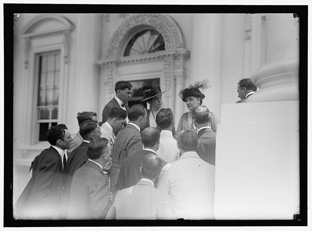Lillian Wald (left) and Jane Addams (right) speak with press correspondents