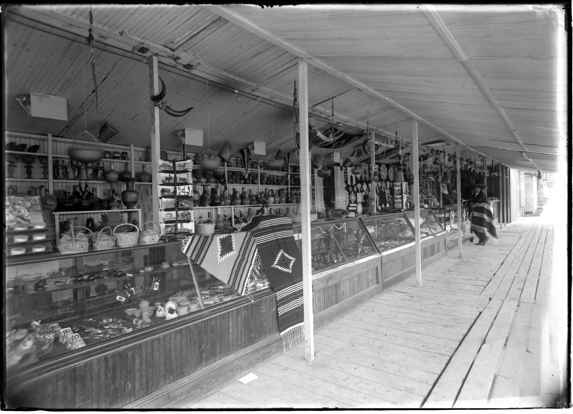 Photo of store shelves, an adult is in the foreground