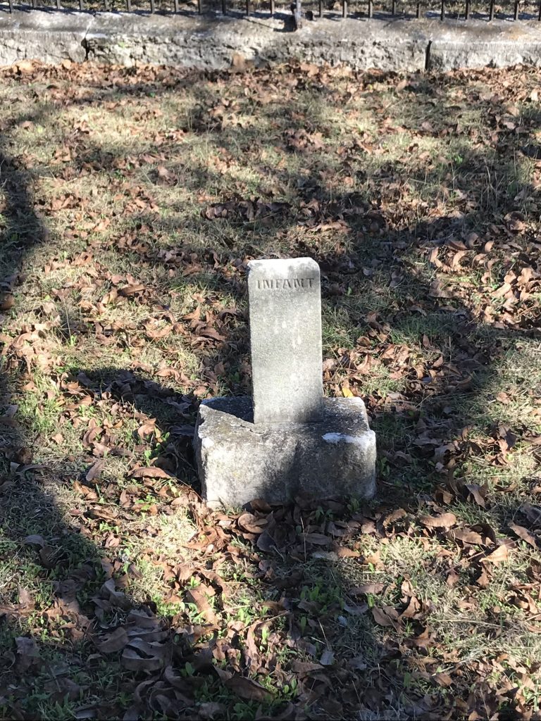 A headstone bearing the simple inscription: "Infant."