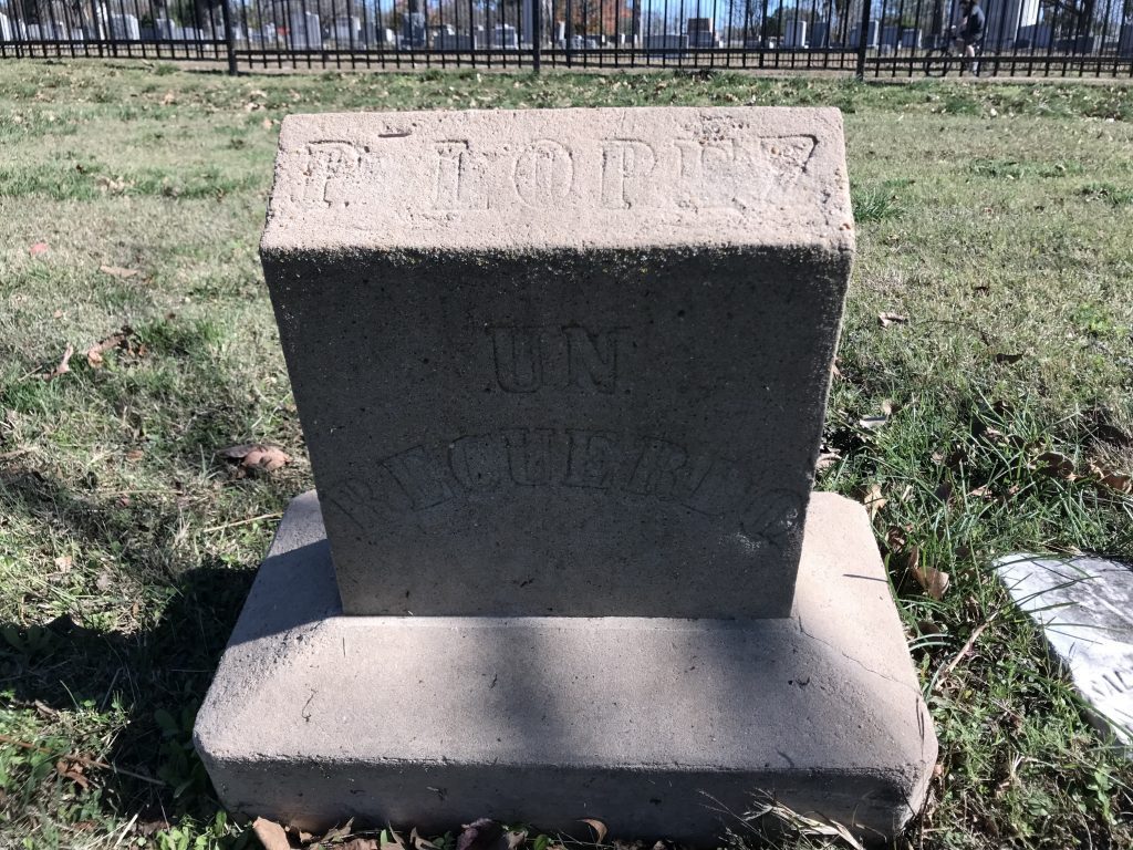 A headstone bearing the inscription: "P. Lopez Unrecuerdo."