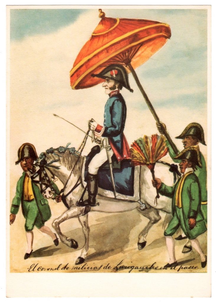 A light-skinned man in blue military uniform, identified as "el colonel de milicias de Lurigancho,"is the central subject of this watercolor painting by Pancho Fierro. The colonel rides a white horse and is accompanied by three dark-skinned attendants in green uniforms, all of whom are on foot. One attendant leads the horse; another holds a large shade umbrella over the colonel's head; and a third fans the colonel.