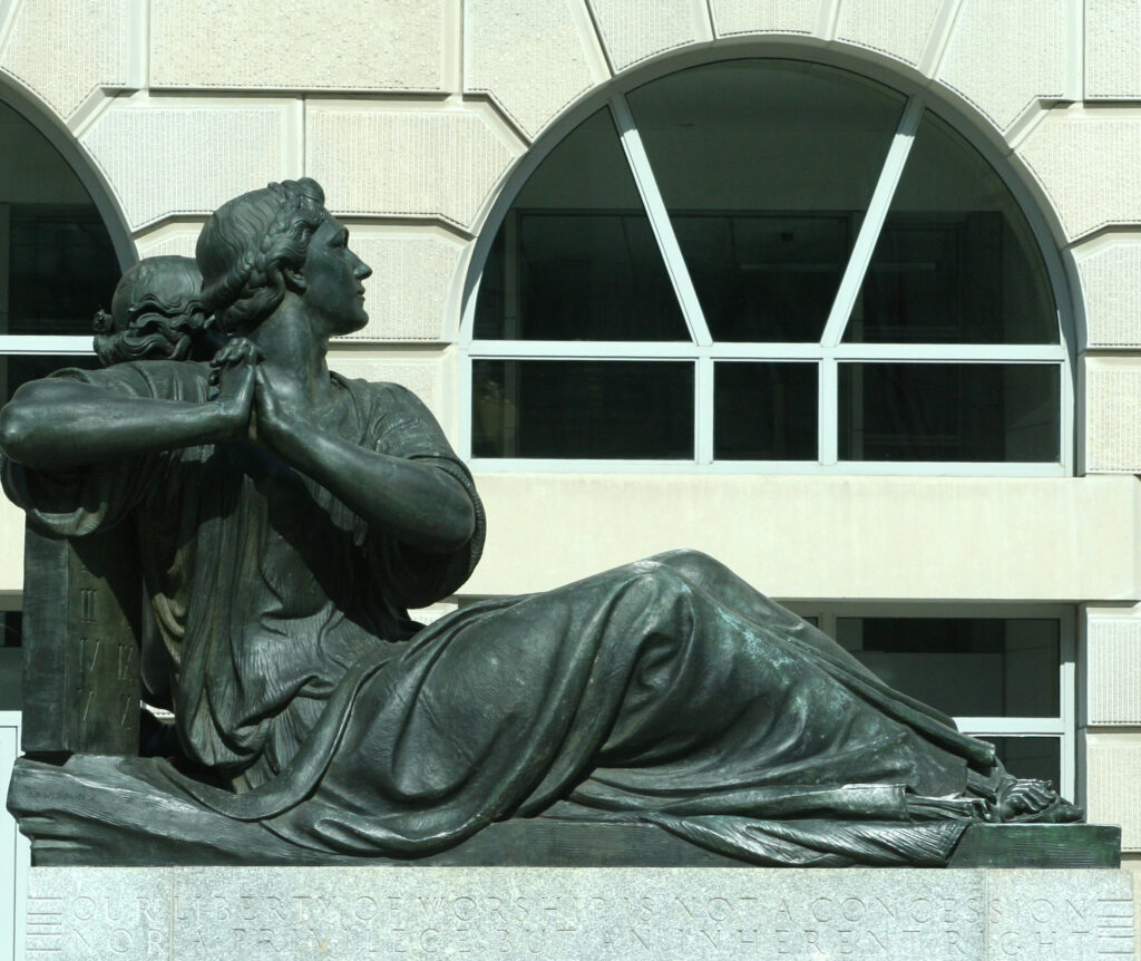 A statue symbolizing religious freedom situated in the exterior plaza of the Ronald Reagan International Trade Center in Washington, D. C. 