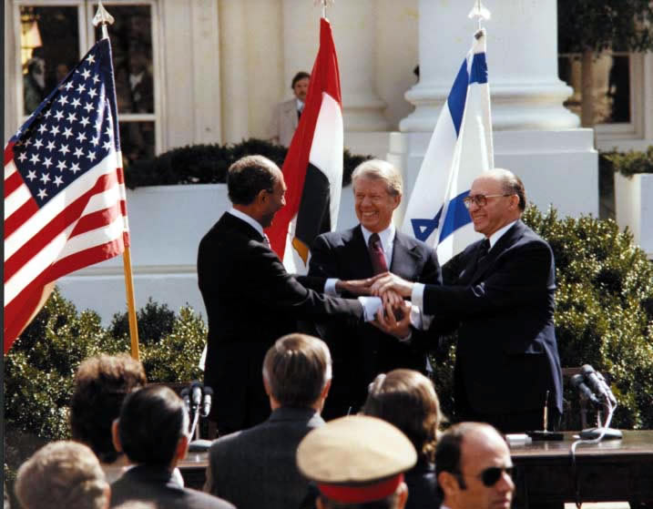 Carter, Sadat, and Begin at the Peace Treaty Signing, March 26, 1979. 