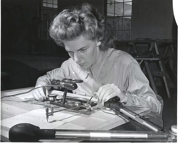 A woman drawing a map, 1943. 