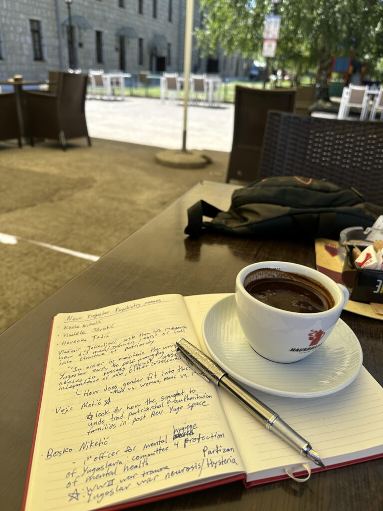 Picture of author's notes and a coffee.