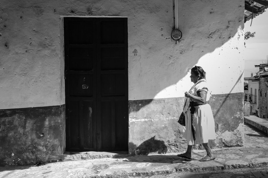 Indigenous woman walking down the street