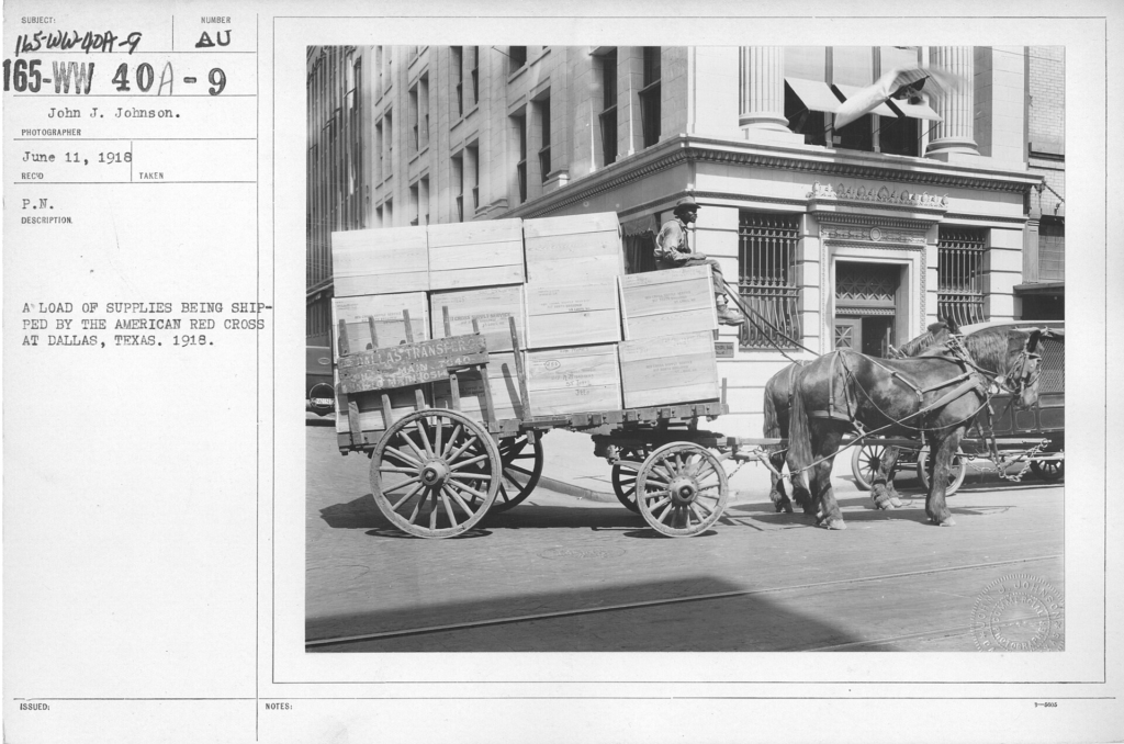 Horse carriage full of boxes with supplies for the Red Cross