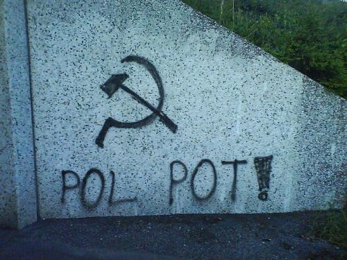 Street art of sickle and hammer, text reads POL POT!