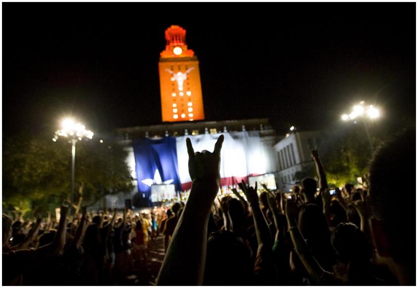 Photograph of UT students gathering under the UT Tower to celebrate the annual Gone to Texas Night